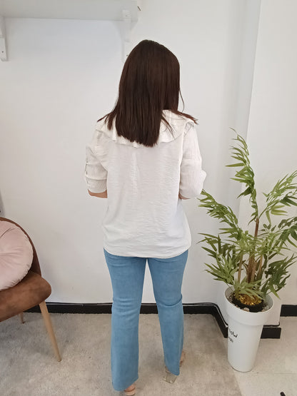 Blusa volantes hueso
